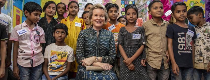 School children pose for a photo with SDG Advocate Queen Mathilde in an ABAL Centre in Bangladesh. Photo:  UN/Farhana Satu